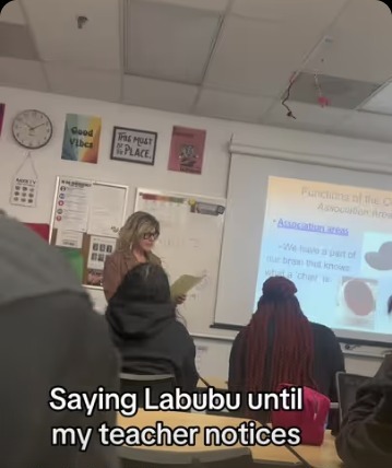 Isra Yasin in a classroom saying "Labubu" until her teacher notices