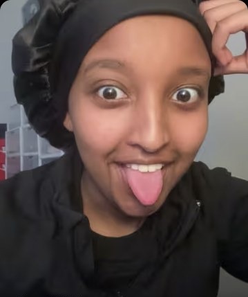 Isra Yasin sticking her tongue out mid-punchline